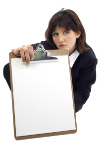 Beautiful Young Businesswoman with Clip Board